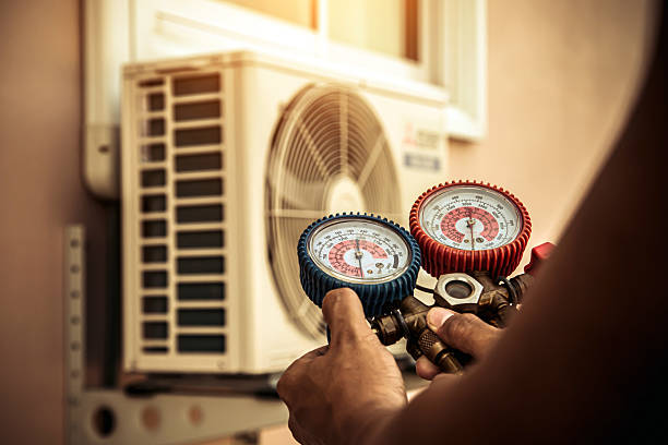Professional Air Conditioning Service technician working in Mackville, KY